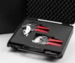 Lugaia SafeSeal tools with red handles, neatly packed in a black foam case – toolset for safely sealing liners in containment systems.