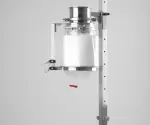 Mounted continuous liner system with stainless steel support and transparent discharge film sealed with a red SafeSeal Crimp – used for secure product transfer in pharmaceutical applications.