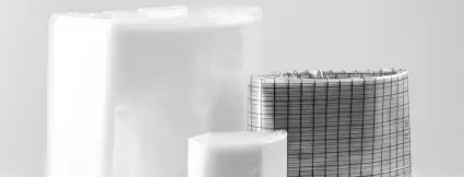 Three different versions of folded continuous liners by Lugaia – including an antistatic liner with black grid structure for use in pharmaceutical and chemical containment processes.